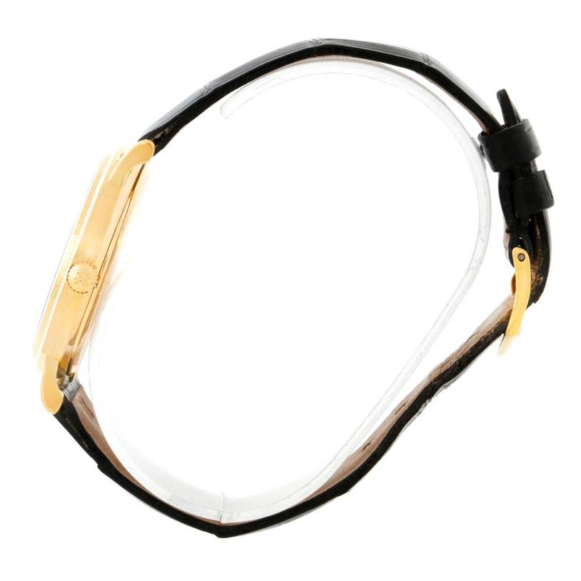 The watch is a Patek Philippe Calatrava 3802 Men's Yellow Gold White Dial 3802 Men's Yellow Gold White Dial model shown from a side angle, displaying its case, crown, and black leather strap.