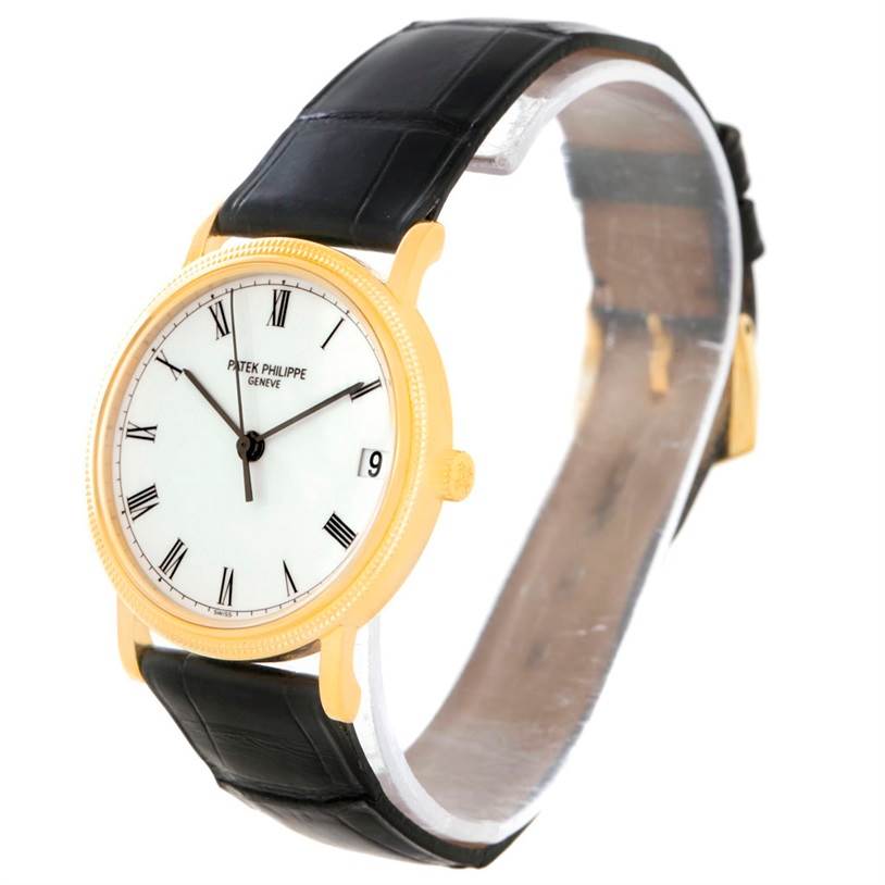 This Patek Philippe Calatrava 3802 Men's Yellow Gold White Dial 3802 Men's Yellow Gold White Dial watch is shown at a slight angle, highlighting its face, gold case, and black leather strap.