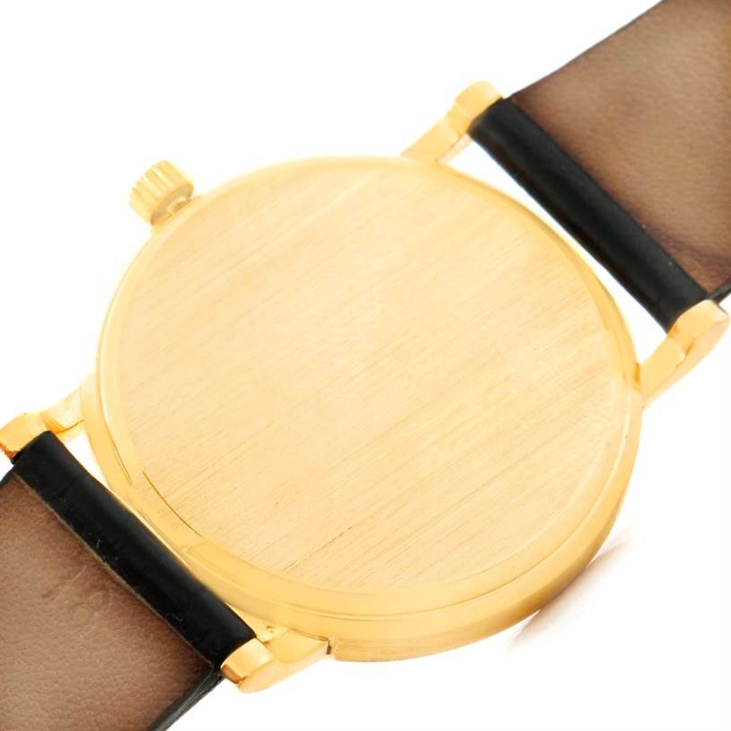 This image shows the back case and strap attachments of a Patek Philippe Calatrava 3802 Men's Yellow Gold White Dial 3802 Men's Yellow Gold White Dial watch at a slight angle.