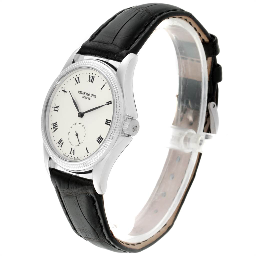 The Patek Philippe Calatrava 5115G Men
s White Gold White Dial 5115G Men
s White Gold White Dial watch is shown at a side angle, highlighting the face, bezel, crown, and leather strap.
