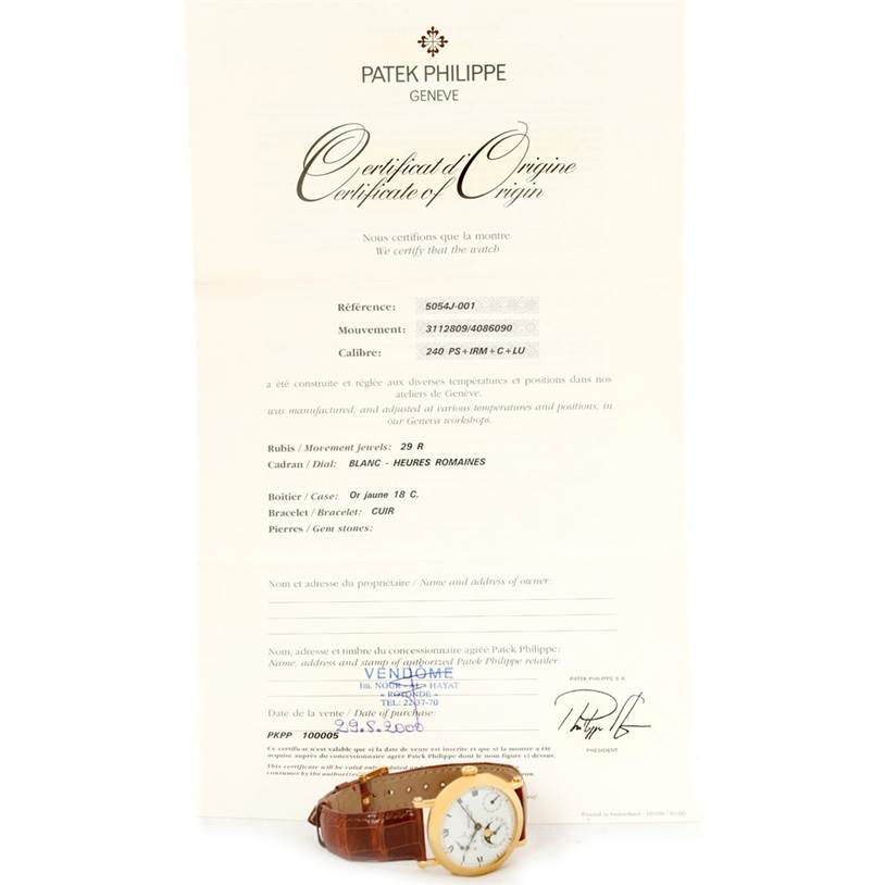 The image shows a Patek Philippe 5054 Men's Yellow Gold White Dial 5054 Men's Yellow Gold White Dial Power Reserve Moonphase Yellow Gold Watch 5054 with a brown leather strap, alongside its certificate.