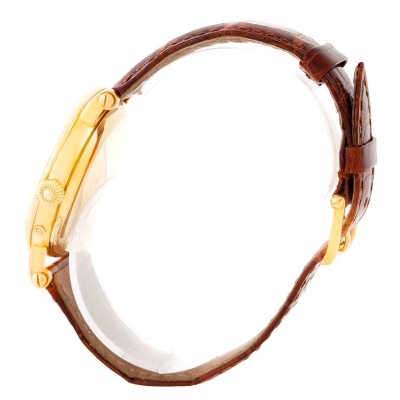 The image shows a side profile of the Patek Philippe 5054 Men's Yellow Gold White Dial 5054 Men's Yellow Gold White Dial Power Reserve Moonphase Yellow Gold Watch 5054 with its crown, case, and leather strap visible.