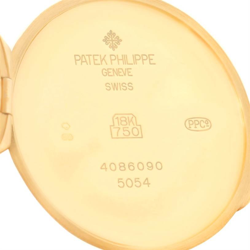 This image shows the inside case back of a Patek Philippe 5054 Men's Yellow Gold White Dial 5054 Men's Yellow Gold White Dial Power Reserve Moonphase Yellow Gold Watch 5054, displaying the model number and material markings.