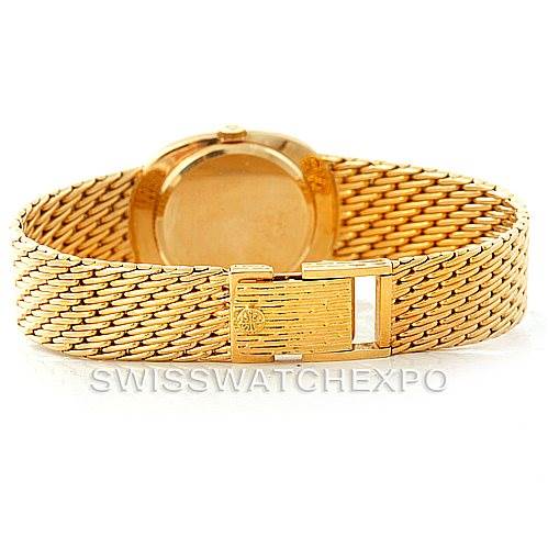 The image shows the back view of the Patek Philippe Golden Ellipse 3848 Men's Yellow Gold Blue Dial 3848 Men's Yellow Gold Blue Dial watch, highlighting its golden bracelet and clasp.