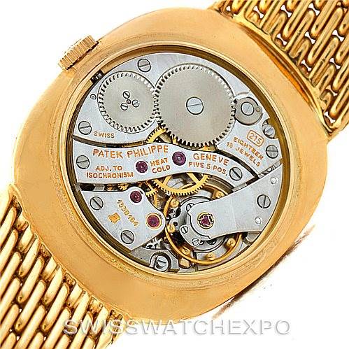 The image shows the back view of a Patek Philippe Golden Ellipse 3848 Men's Yellow Gold Blue Dial 3848 Men's Yellow Gold Blue Dial watch, revealing its internal mechanical movement.