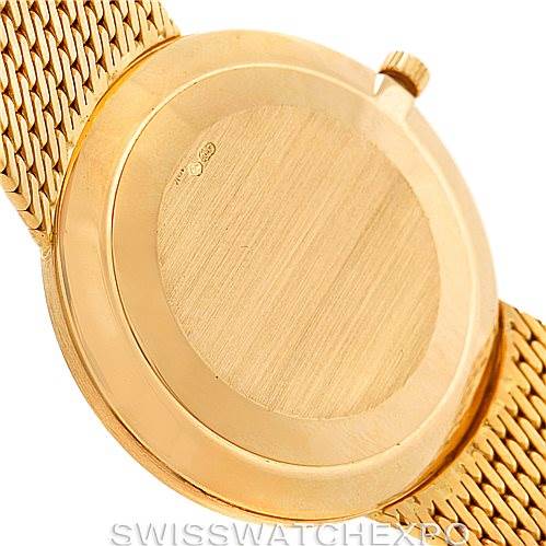 The image shows the back case and a portion of the mesh strap of the Patek Philippe Calatrava 3919 Men's Yellow Gold White Dial 3919 Men's Yellow Gold White Dial watch from a rear view.