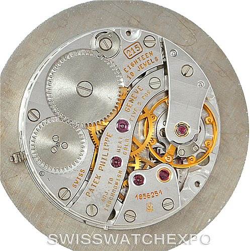 The image shows the intricate inner mechanics of a Patek Philippe Calatrava 3919 Men's Yellow Gold White Dial 3919 Men's Yellow Gold White Dial watch, viewed from the back.