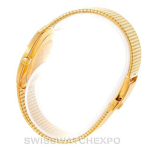 The image shows a side view of the Patek Philippe Calatrava 3919 Men's Yellow Gold White Dial 3919 Men's Yellow Gold White Dial watch, highlighting its gold case and bracelet.