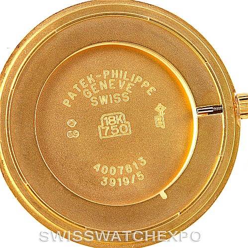 This image shows the back case of a Patek Philippe Calatrava 3919 Men's Yellow Gold White Dial 3919 Men's Yellow Gold White Dial watch, displaying the gold content and serial number.