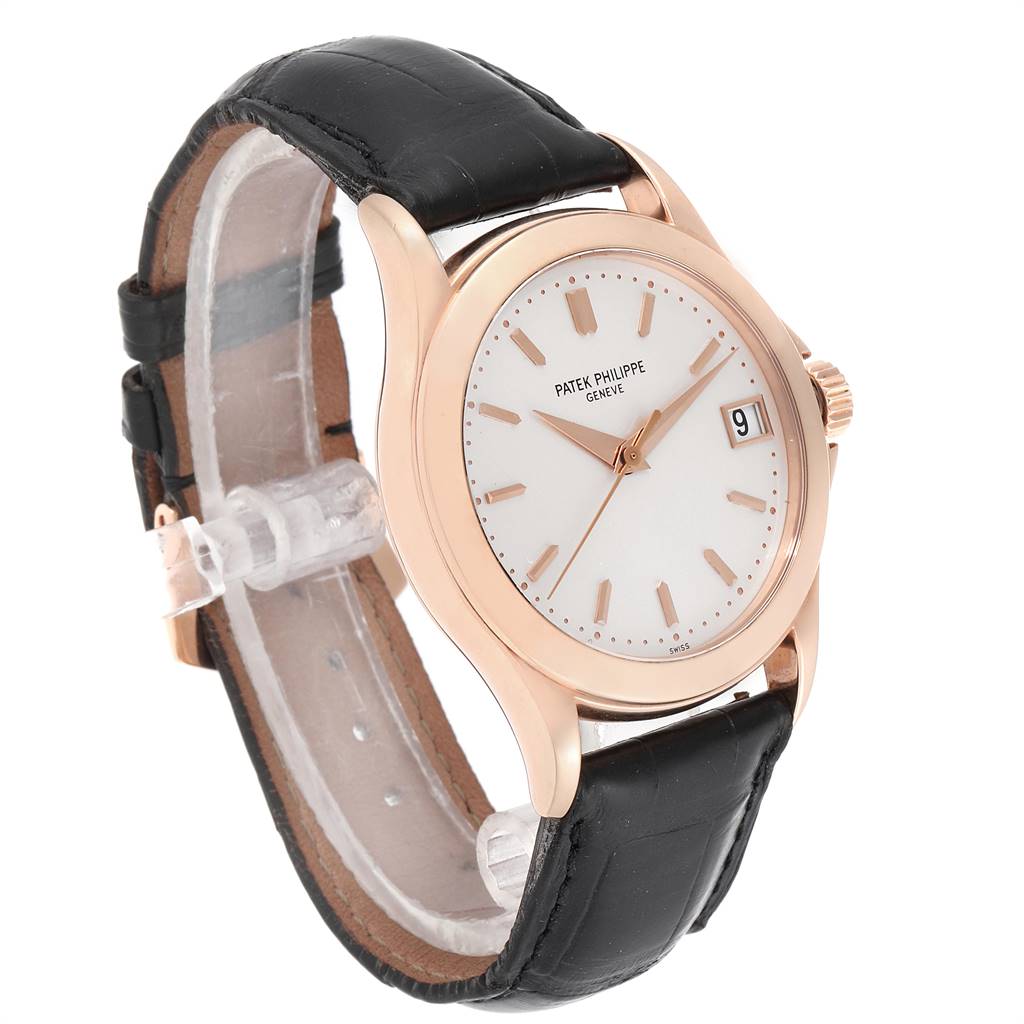 The image shows a Patek Philippe Calatrava 5107R Men's Rose Gold Silver Dial 5107R Men's Rose Gold Silver Dial watch at a three-quarter angle highlighting the dial, bezel, and black leather strap.