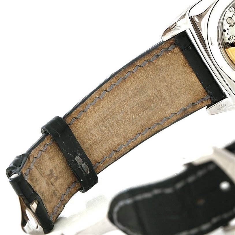 The image shows the inner side of the strap and part of the back case of a Patek Philippe 5135G White Gold Silver Dial 5135G White Gold Silver Dial Gondolo Calendario 18K White Gold Watch 5135G.