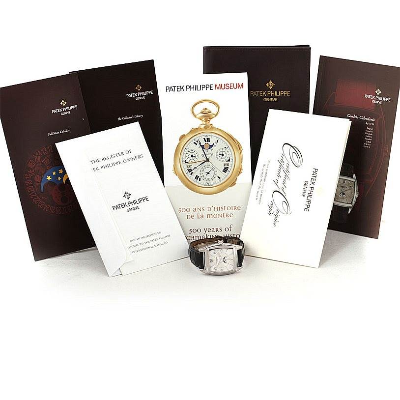 The image shows a Patek Philippe 5135G White Gold Silver Dial 5135G White Gold Silver Dial Gondolo Calendario 18K White Gold Watch 5135G model along with its papers and accessories.