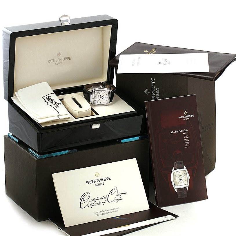 The image shows a Patek Philippe 5135G White Gold Silver Dial 5135G White Gold Silver Dial Gondolo Calendario 18K White Gold Watch 5135G with its open box, booklet, and certification documents.