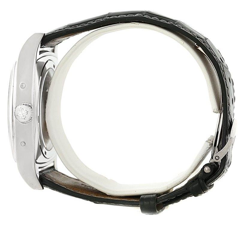 The image shows a side view of the Patek Philippe 5135G White Gold Silver Dial 5135G White Gold Silver Dial Gondolo Calendario 18K White Gold Watch 5135G with its case, crown, and strap.