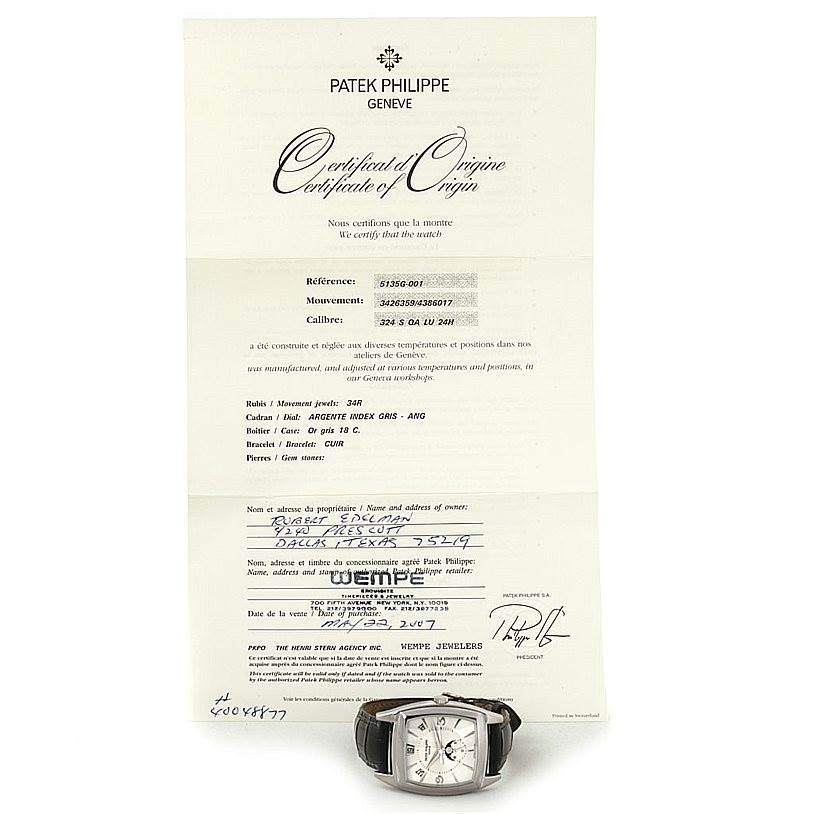 The image displays a Patek Philippe 5135G White Gold Silver Dial 5135G White Gold Silver Dial Gondolo Calendario 18K White Gold Watch 5135G placed in front of its certificate of origin.