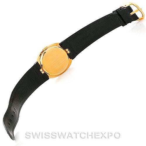 The image shows the back and strap of a Patek Philippe Golden Ellipse 3948 Men's Yellow Gold White Dial 3948 Men's Yellow Gold White Dial watch, displaying its leather band and golden case back from a top-down angle.