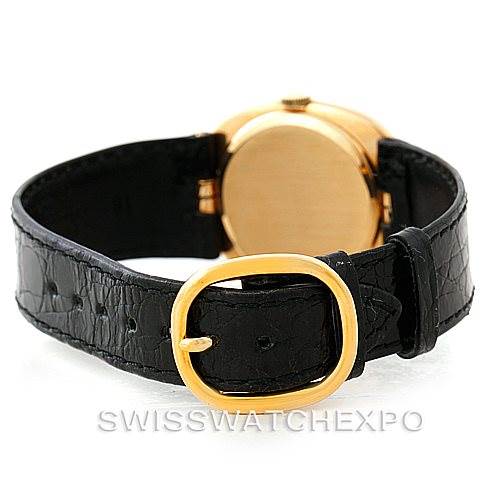 The image shows the rear view of a Patek Philippe Golden Ellipse 3948 Men's Yellow Gold White Dial 3948 Men's Yellow Gold White Dial watch, highlighting its black strap and golden buckle.