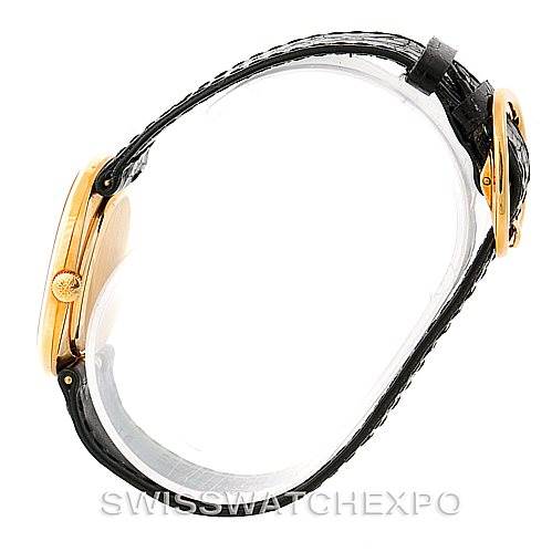 The image shows a side view of the Patek Philippe Golden Ellipse 3948 Men's Yellow Gold White Dial 3948 Men's Yellow Gold White Dial watch, highlighting its case, crown, and leather strap.