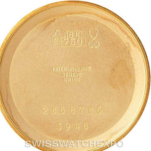 This image shows the inner side of the case back of a Patek Philippe Golden Ellipse 3948 Men's Yellow Gold White Dial 3948 Men's Yellow Gold White Dial watch, displaying inscriptions and hallmarks.