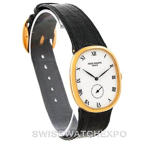 The image shows a side angle view of the Patek Philippe Golden Ellipse 3948 Men's Yellow Gold White Dial 3948 Men's Yellow Gold White Dial watch, highlighting its black strap and oval gold case.