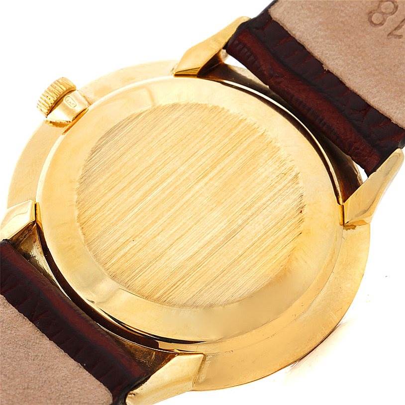 The image shows the back case and part of the strap of a Vintage Patek Philippe watch.