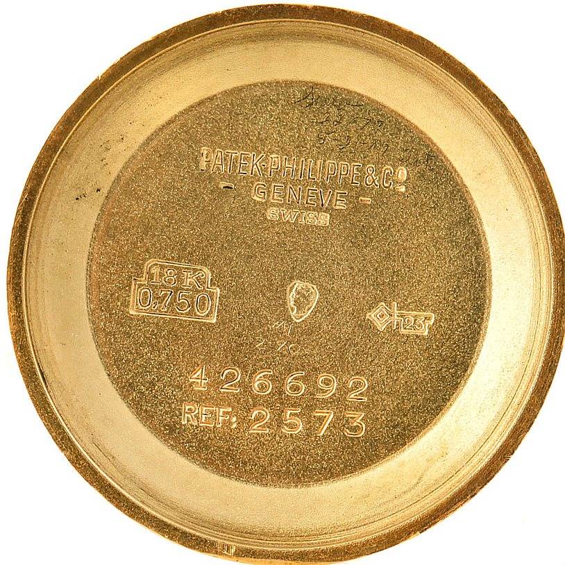 The image shows the inner case back of a Vintage Patek Philippe watch, model reference 2573, with various engravings and markings.
