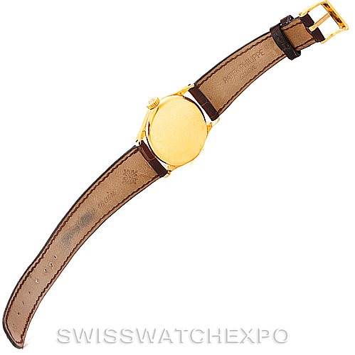 This image displays the back view of a Vintage Patek Philippe watch with a leather strap fully extended.