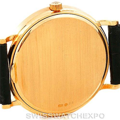 This image shows the back view of the case of a Patek Philippe Calatrava 3944 Men's Yellow Gold White Dial 3944 Men's Yellow Gold White Dial watch, highlighting the crown and parts of the lugs and strap attachment.