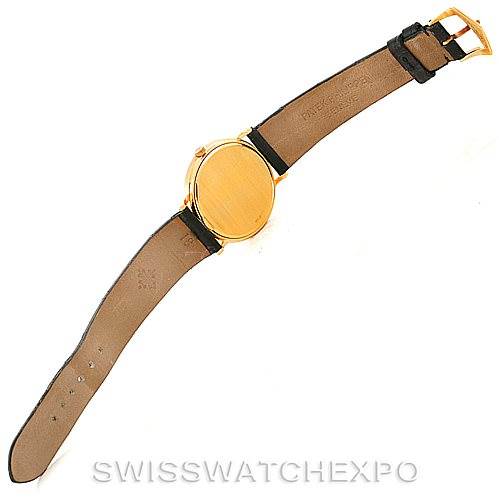 The image shows the back view of a Patek Philippe Calatrava 3944 Men's Yellow Gold White Dial 3944 Men's Yellow Gold White Dial watch, including the leather strap and gold buckle.