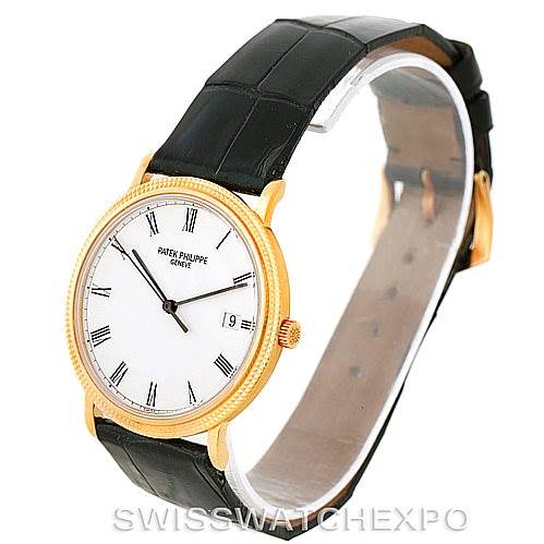 This image shows a Patek Philippe Calatrava 3944 Men's Yellow Gold White Dial 3944 Men's Yellow Gold White Dial watch at an angled side view, highlighting its face, strap, and gold casing.
