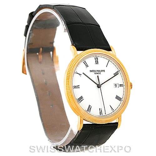 The image shows a Patek Philippe Calatrava 3944 Men's Yellow Gold White Dial 3944 Men's Yellow Gold White Dial watch at a slightly angled side view, displaying its face, black leather strap, and gold case.