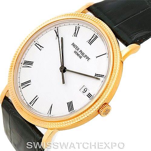 The image shows a Patek Philippe Calatrava 3944 Men's Yellow Gold White Dial 3944 Men's Yellow Gold White Dial watch from a three-quarter top view, highlighting its dial, crown, and black leather strap.