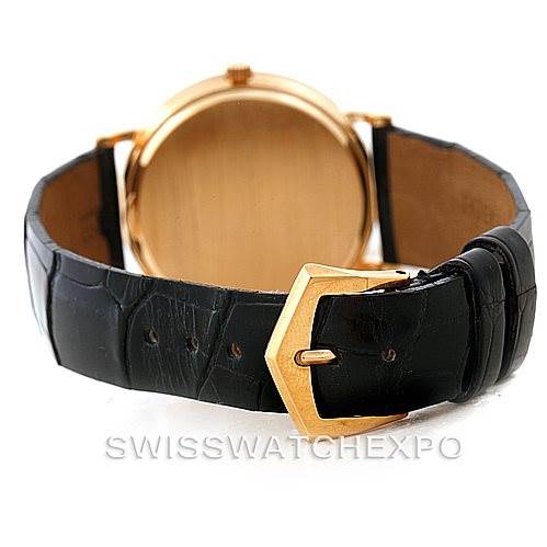 The image shows the back of the Patek Philippe Calatrava 3944 Men's Yellow Gold White Dial 3944 Men's Yellow Gold White Dial watch, focusing on its leather strap and gold buckle.