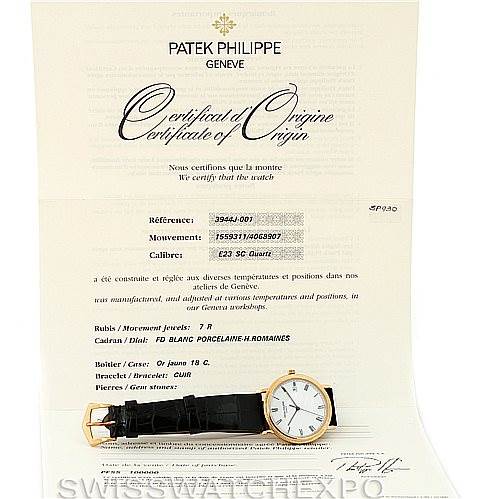 The image shows a Patek Philippe Calatrava 3944 Men's Yellow Gold White Dial 3944 Men's Yellow Gold White Dial model watch placed on its Certificate of Origin document.