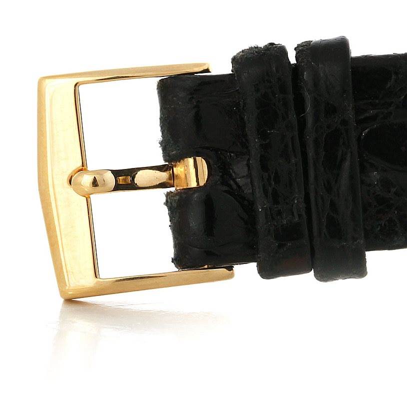 This image shows a close-up of the gold buckle and black leather strap of a Patek Philippe Calatrava 3919 Men's Yellow Gold White Dial 3919 Men's Yellow Gold White Dial watch.