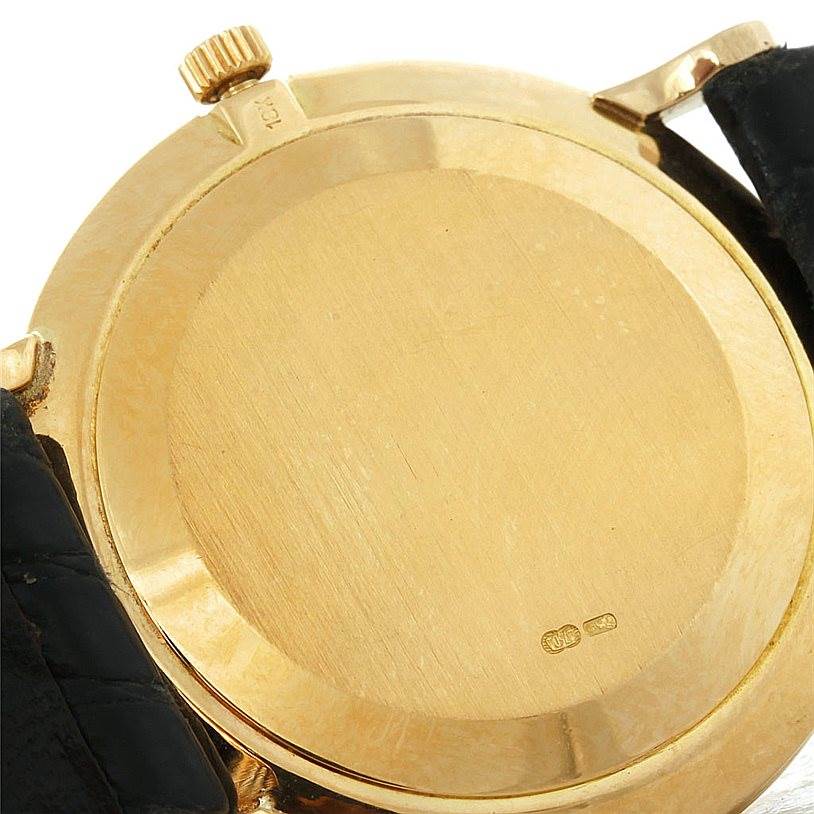 The image shows the back case and part of the band of a Patek Philippe Calatrava 3919 Men's Yellow Gold White Dial 3919 Men's Yellow Gold White Dial watch at an angle displaying the crown and lugs.