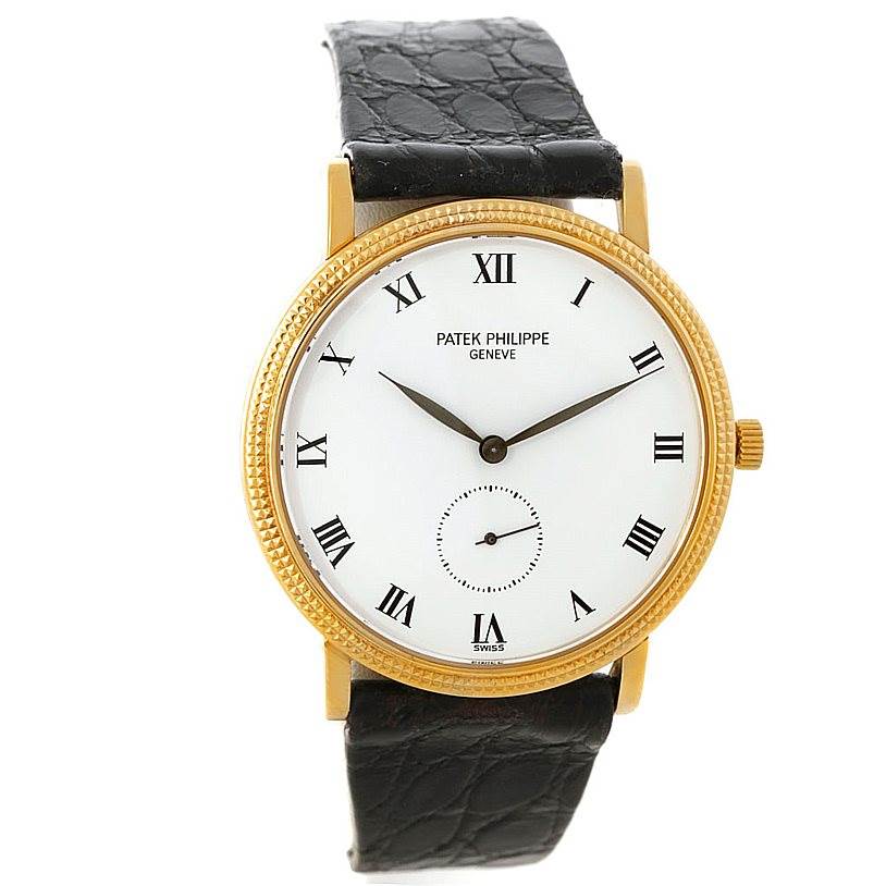 The image shows a frontal view of a Patek Philippe Calatrava 3919 Men's Yellow Gold White Dial 3919 Men's Yellow Gold White Dial watch with a gold case, white dial, black leather strap, and Roman numerals.