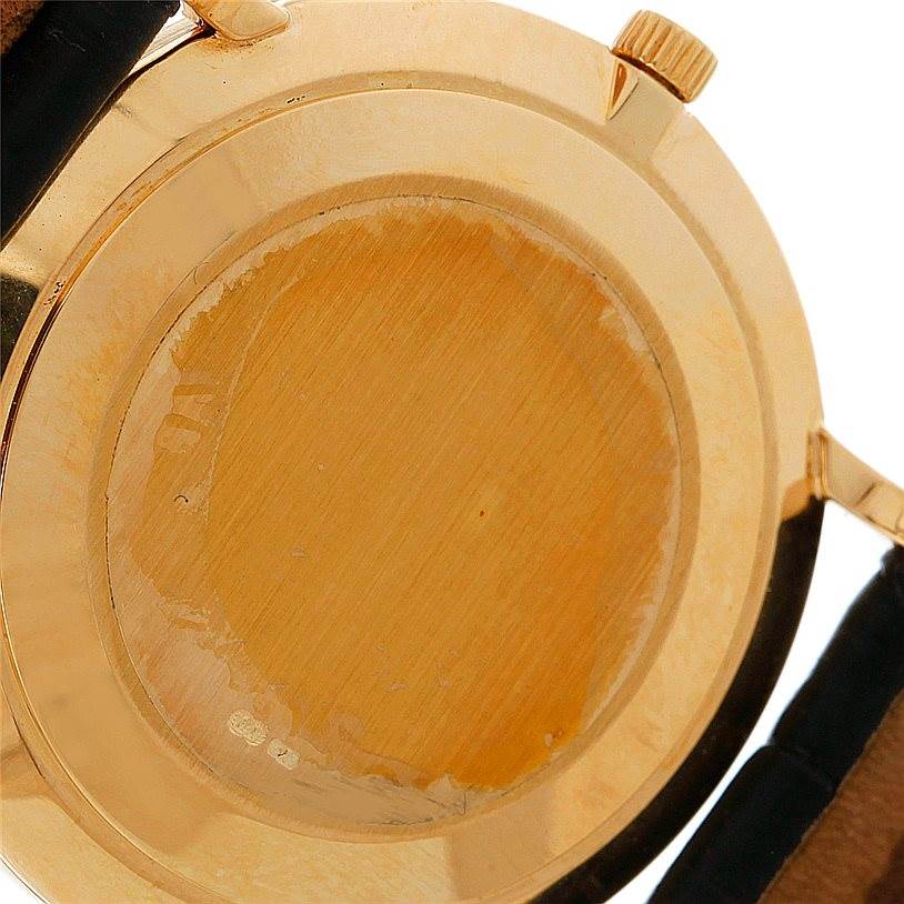 The image shows the gold case back, lugs, and part of the leather strap of a Patek Philippe Calatrava 3919 Men's Yellow Gold White Dial 3919 Men's Yellow Gold White Dial watch.