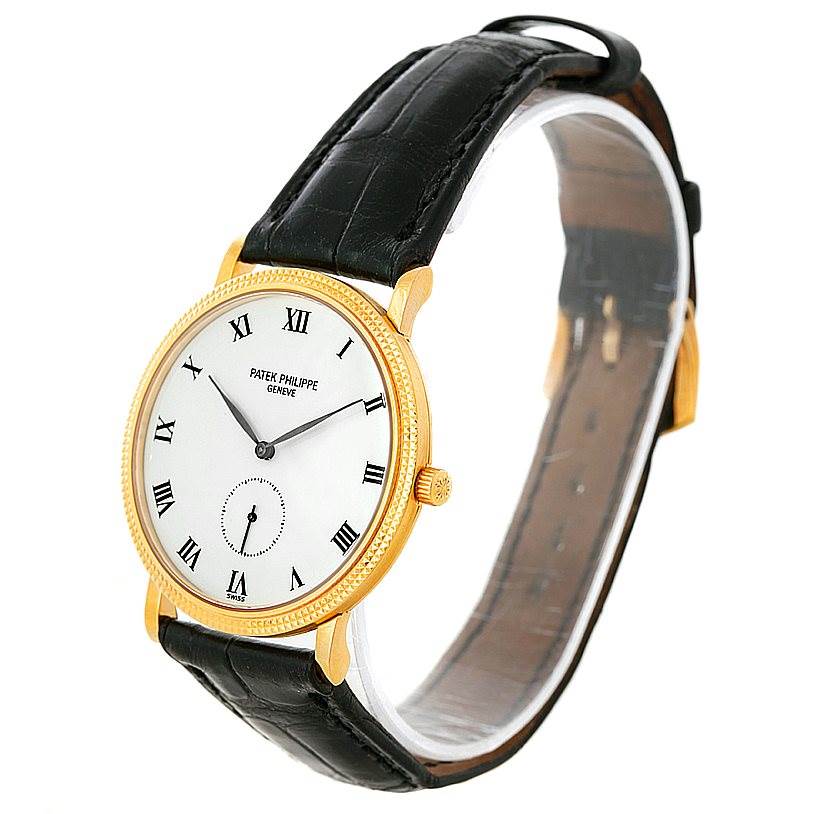 The Patek Philippe Calatrava 3919 Men's Yellow Gold White Dial 3919 Men's Yellow Gold White Dial watch is shown at a three-quarter angle, highlighting its gold case, white dial, and black leather strap.