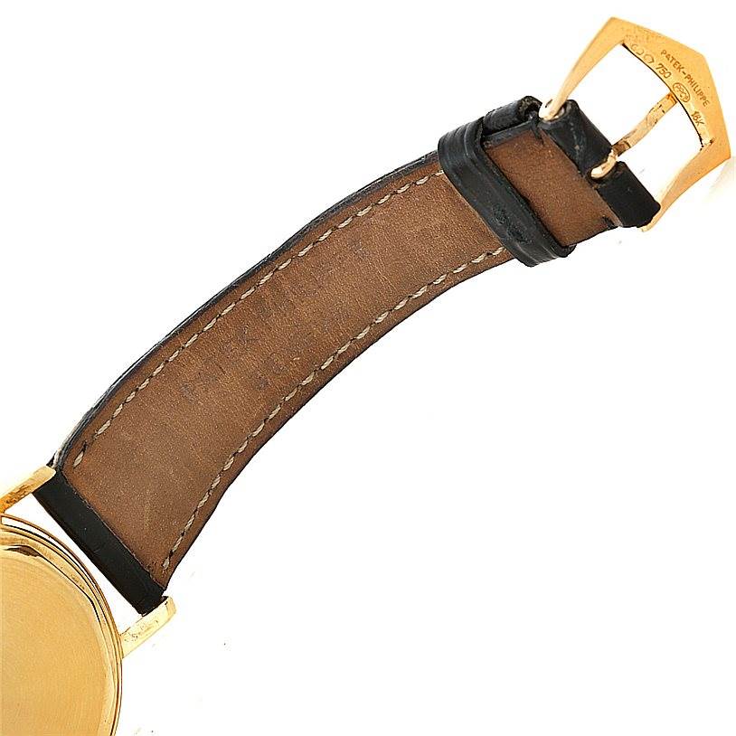 The image shows the back side with the brown leather strap and gold buckle of a Vintage Patek Philippe watch.