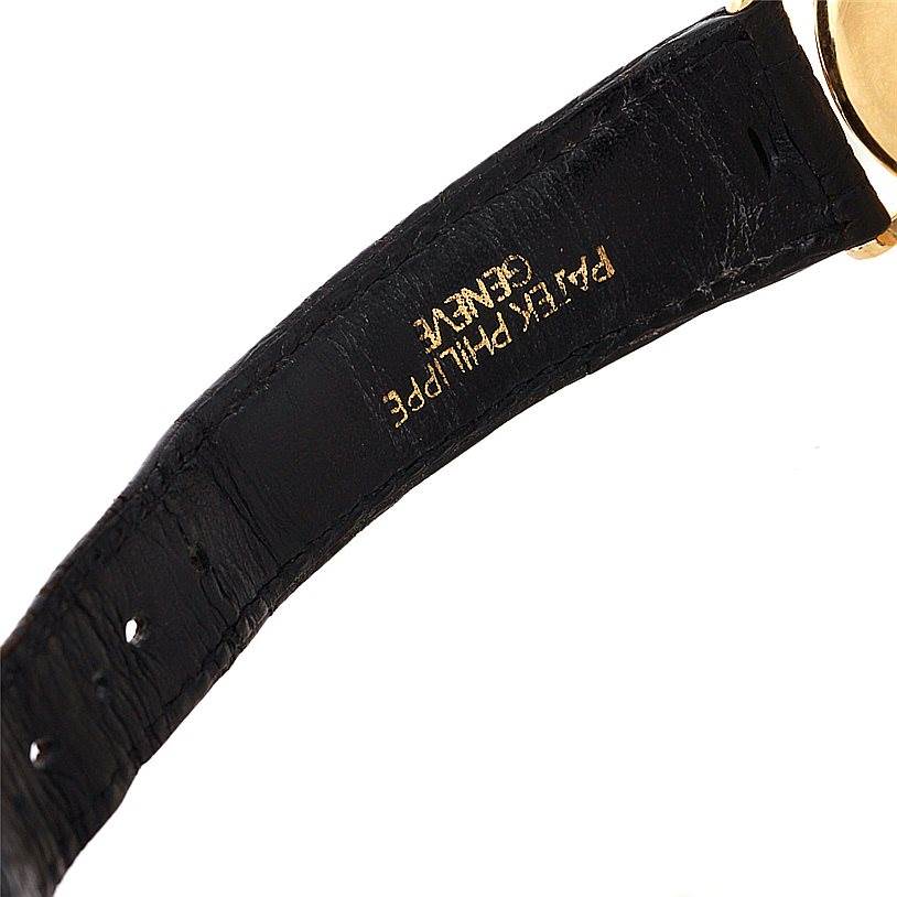 The image shows a close-up of the inside of the strap of a vintage Patek Philippe watch.