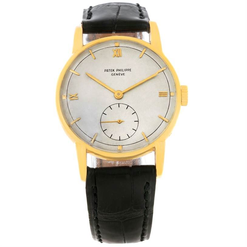 This image shows a front view of a Vintage Patek Philippe watch, highlighting its dial, hands, and black leather strap.