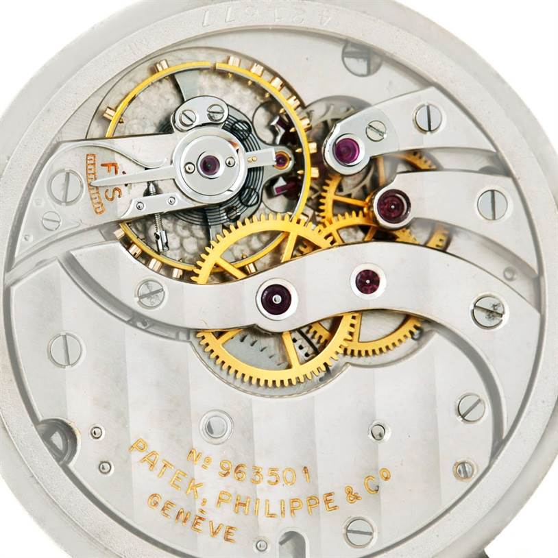 This is a close-up view of the inner mechanical parts of a Vintage Patek Philippe watch movement.