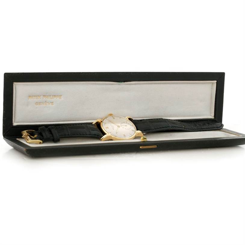 The image shows a Patek Philippe Vintage model watch in its open case, displaying the watch face, strap, and case interior.