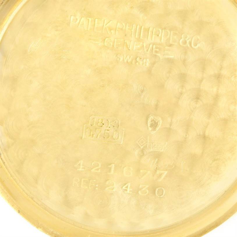 The image shows the inside of the case back of a Vintage Patek Philippe watch model Ref. 2430.
