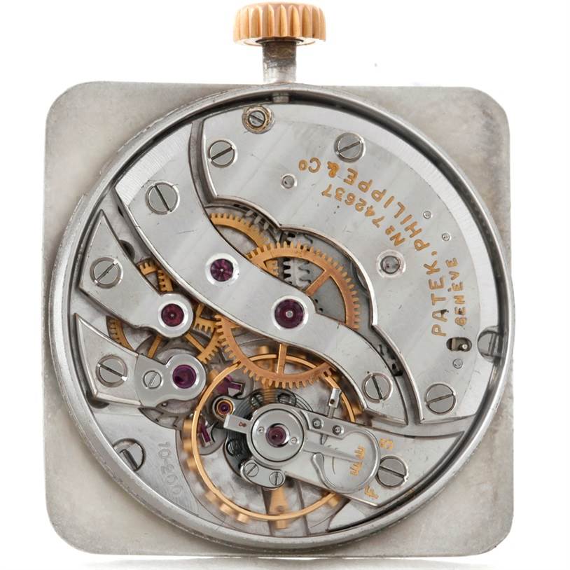 This image shows a close-up of the internal mechanical movement of a Patek Philippe Calatrava 2493 Men's Rose Gold Silver Dial 2493 Men's Rose Gold Silver Dial watch.