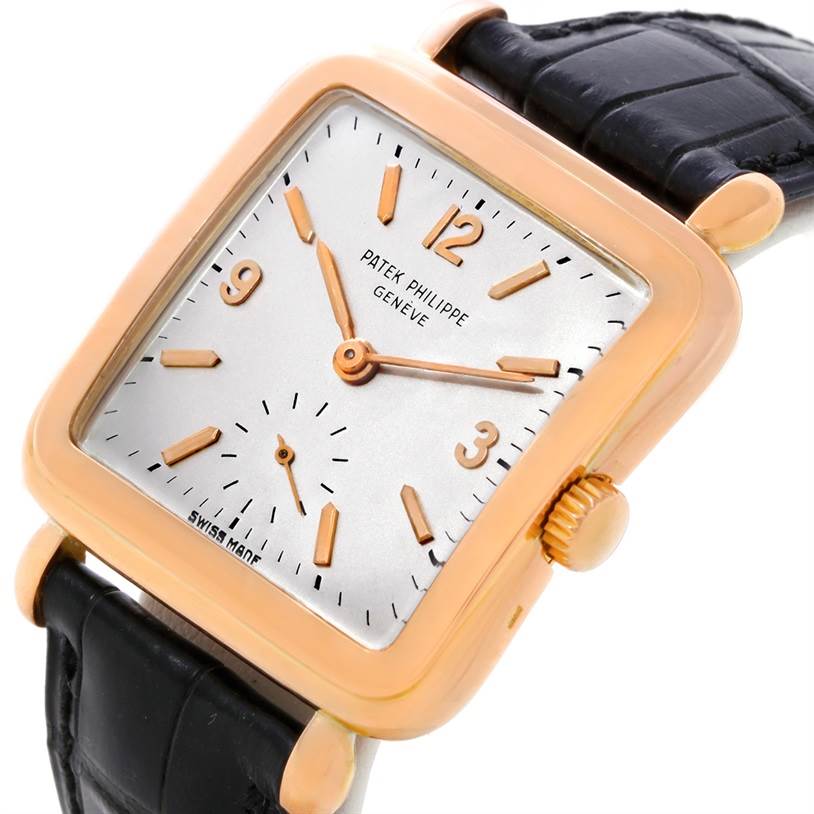 The image shows a close-up angled view of the face, bezel, and strap of a Patek Philippe Calatrava 2493 Men's Rose Gold Silver Dial 2493 Men's Rose Gold Silver Dial watch.