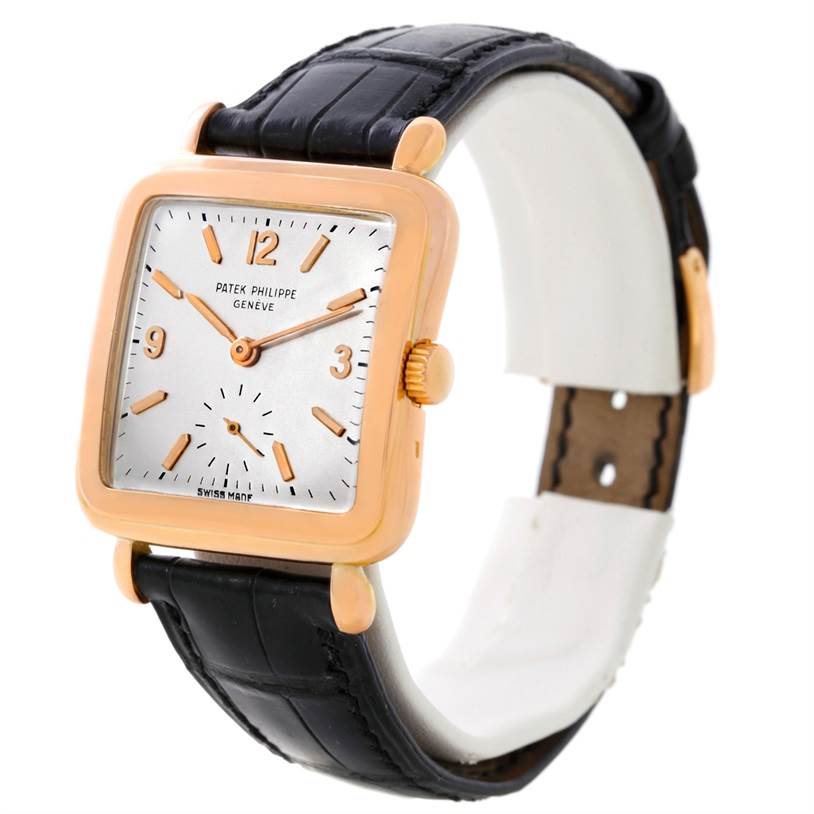 The image shows a Patek Philippe Calatrava 2493 Men's Rose Gold Silver Dial 2493 Men's Rose Gold Silver Dial watch at a three-quarter angle, highlighting the dial, case, crown, and black leather strap.
