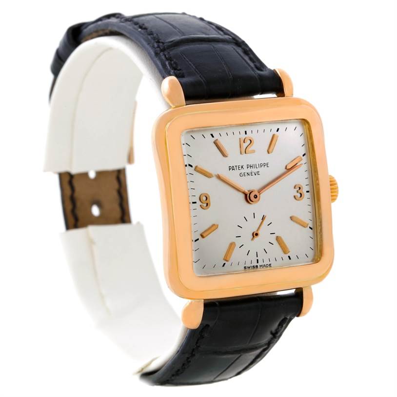 This Patek Philippe Calatrava 2493 Men's Rose Gold Silver Dial 2493 Men's Rose Gold Silver Dial watch is shown from a three-quarter angle, displaying the face, case, and part of the black leather strap.