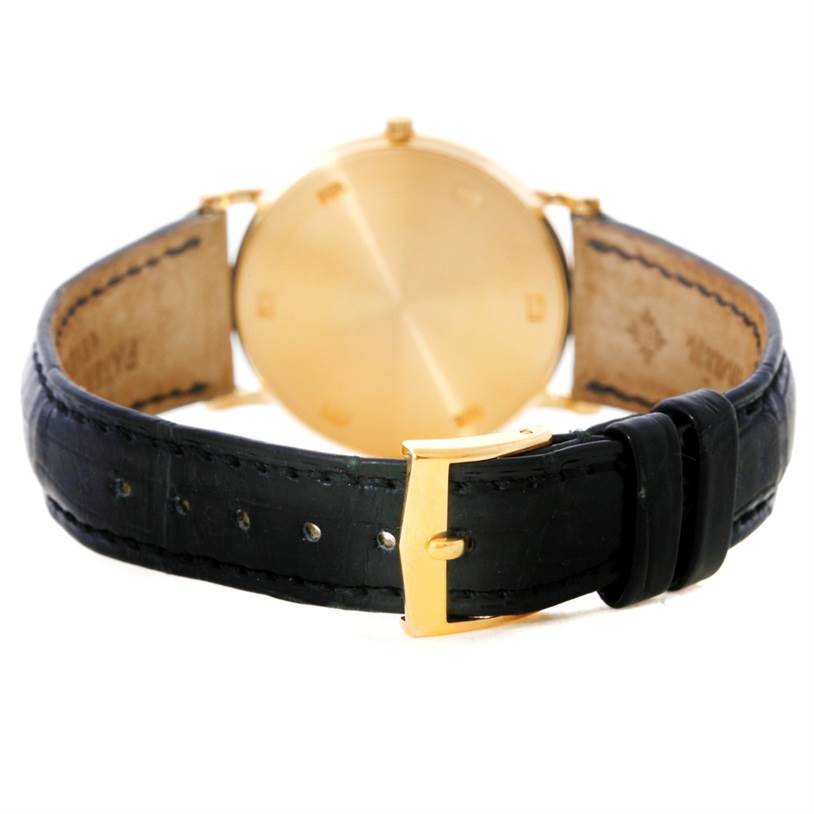 This image shows the back of the Patek Philippe Calatrava 3520 Men's Yellow Gold White Dial 3520 Men's Yellow Gold White Dial watch, featuring the strap and buckle.